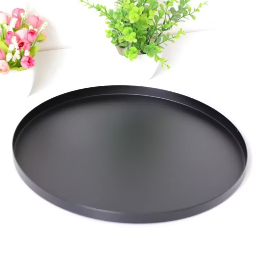 Round iron serving tray with a black powder-coated finish